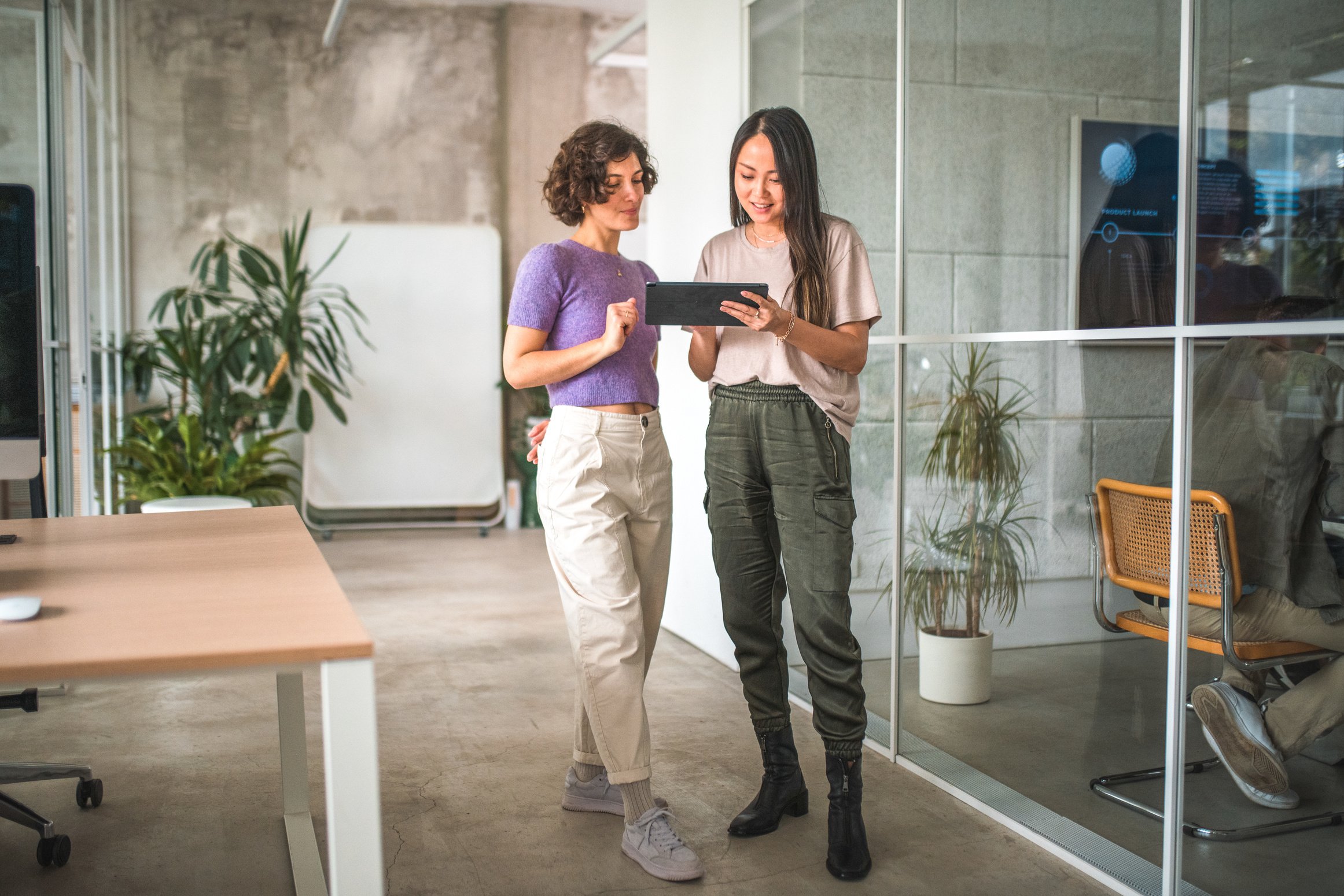 Multicultural Digital Marketing Female Colleagues Analyzing Market Trends